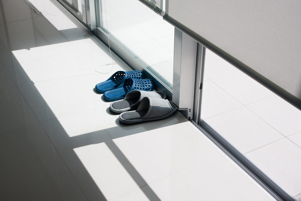 Showing the Asian custom of removing shoes before entering home