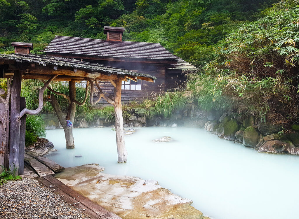 Akita, JP - SEPTEMBER 28, 2018: Scenery of "Tsuru no Yu Onsen", the famous landmark natural hot springs in Nyutou City in Akita Province, that have milky white hot water on the bathing pond.